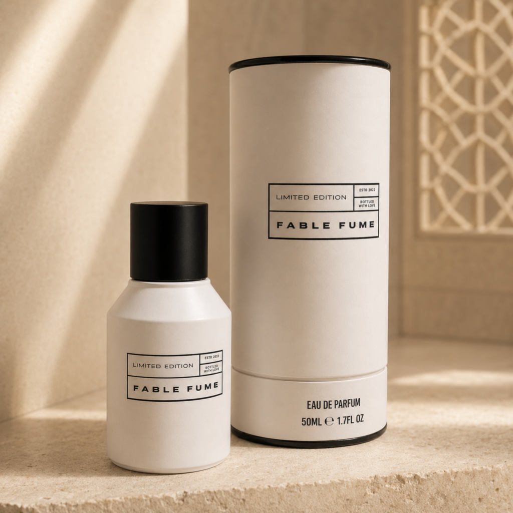 Fable Fume Chapter 01 perfume bottle and cylindrical packaging in warm beige light